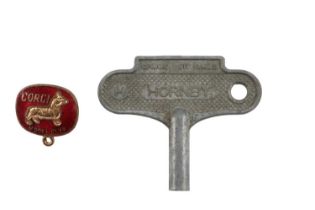 A Corgi Model Club enamelled badge together with a Hornby clockwork model railway key and track