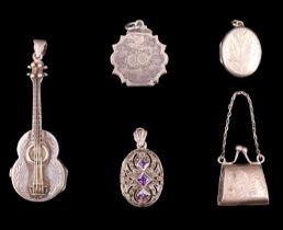 Three white metal lockets, one set with amethyst, together with a novelty guitar-form pendant pill