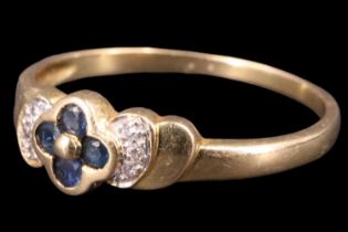 A contemporary sapphire and diamond finger ring, having four 1.5 mm sapphire brilliants set in a