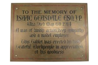 A large brass memorial plaque engraved: "To the Memory of Isaac Teasdale Esq JP, Who Died May 6th