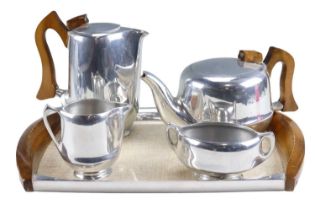A four piece Picquot Ware tea set on a conforming tray