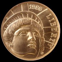 A 1986 W Liberty $5 (five dollar) gold coin, non-circulating Statue of Liberty Centennial