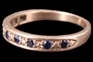 A sapphire half-hoop eternity ring, set with nine 1.5 mm sapphire brilliants in a 9 ct yellow