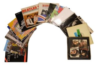 A quantity of The Beatles LP vinyl records including the re-issued "White Album", "Let It Be", etc