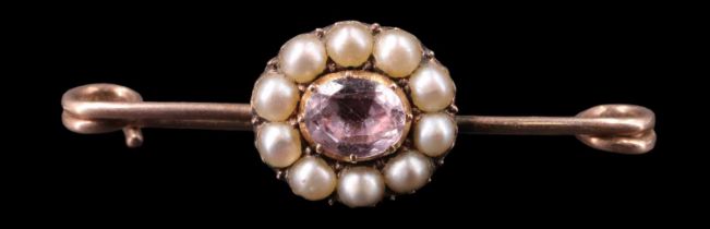 A Victorian gemset and pearl brooch, the central 5 x 6.5 mm oval stone, possibly a pink topaz, in