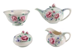 A Royal Doulton by Franz floral moulded three piece tea set with a covered box