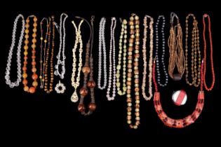 A quantity of vintage and later necklaces including hardstone, tiger's eye, pewter pearls, etc