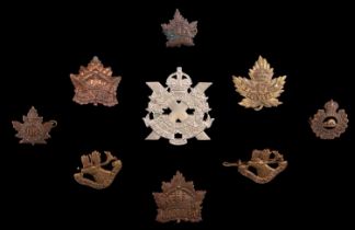 A small group of Canadian cap and other badges including a 47th Overseas Battalion badge