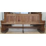 A Victorian pitch pine pew / settle, having splayed ends, 232 x 50 x 97 cm