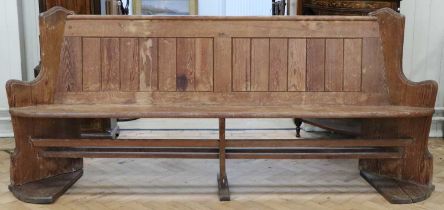 A Victorian pitch pine pew / settle, having splayed ends, 232 x 50 x 97 cm