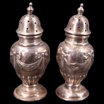 A pair of early 20th Century Neo-Classical Revival silver pepperettes, Sheffield, marks
