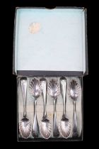 A boxed set of six Victorian silver teaspoons having shell-form bowls and honeysuckle terminals,