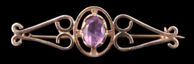 An amethyst and 9 ct gold brooch, the oval (approximately 1.25 carats) in a bezel setting within