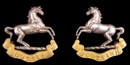 A pair of Second World War Liverpool Scottish officer's bi-metallic collar badges by Gaunt, in white
