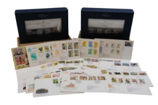 Two Royal Mail Millenium Collection mint stamp packs together with a small group of first day