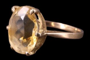 A Victorian citrine finger ring, having an oval stone of approximately 3.25 carats set on a hand-