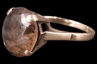 A late 20th Century smoky quartz finger ring, comprising a smoky quartz brilliant of approximately 5