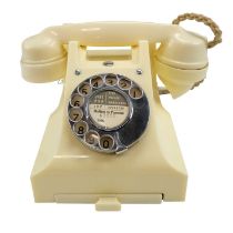 A 1940s / 1950s GPO 300 series ivory Bakelite rotary dial telephone with drawer, base marked 5677