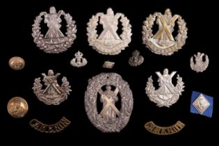 A group of Queen's Own Cameron Highlanders cap and other badges and insignia
