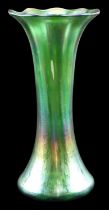 A Loetz type iridescent green glass vase, of waisted form with an everted rim, pontil mark to
