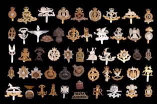 A group of military cap and other badges