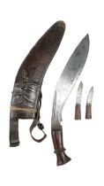 A military type kukri, in scabbard with by knives and military type frog, Great War / Second World