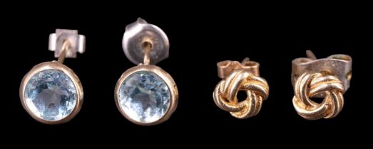 Two pairs of contemporary stud earrings, comprising a pair of 9 ct gold knots, and 5.5 mm spinel set