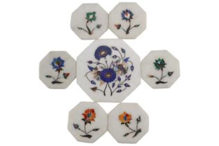 A set of seven Indian pietra dura floral decorated marble coasters, likely Agra, late 20th