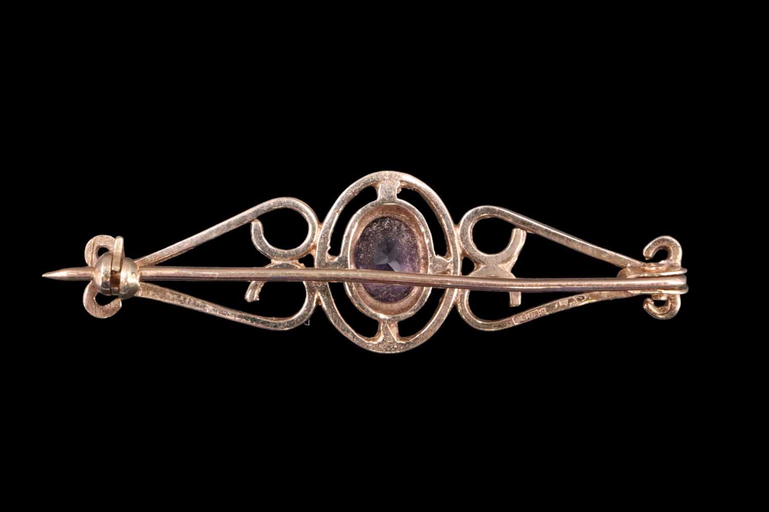 An amethyst and 9 ct gold brooch, the oval (approximately 1.25 carats) in a bezel setting within - Image 2 of 3