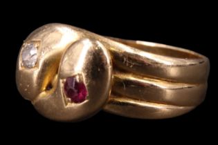 A late Victorian diamond and ruby entwined "serpents" finger ring, having reeded shoulders
