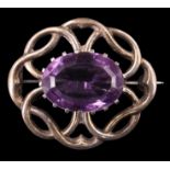 A vintage Scottish amethyst brooch, having an oval of approximately 18 carats (18 x 13 mm) in a
