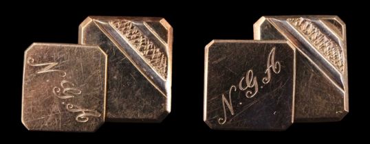 A pair of yellow metal cufflinks, on each the backing link engraved 'NGA', and engraved 'With Love