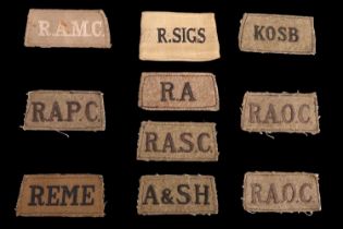 A small collection of Second World War British army slip-on shoulder titles