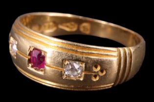 A Victorian diamond and ruby finger ring, having a 2.5 mm ruby between two 2 mm diamond