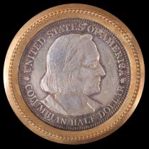 A US 1892 (Chicago World's Fair) Colombian Half Dollar coin set in a gilt metal brooch frame, 36.5