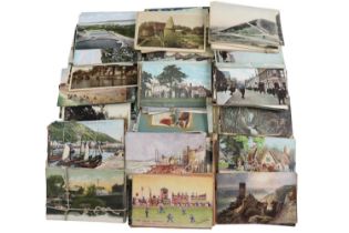 A collection of early 20th Century and later polychrome postcards