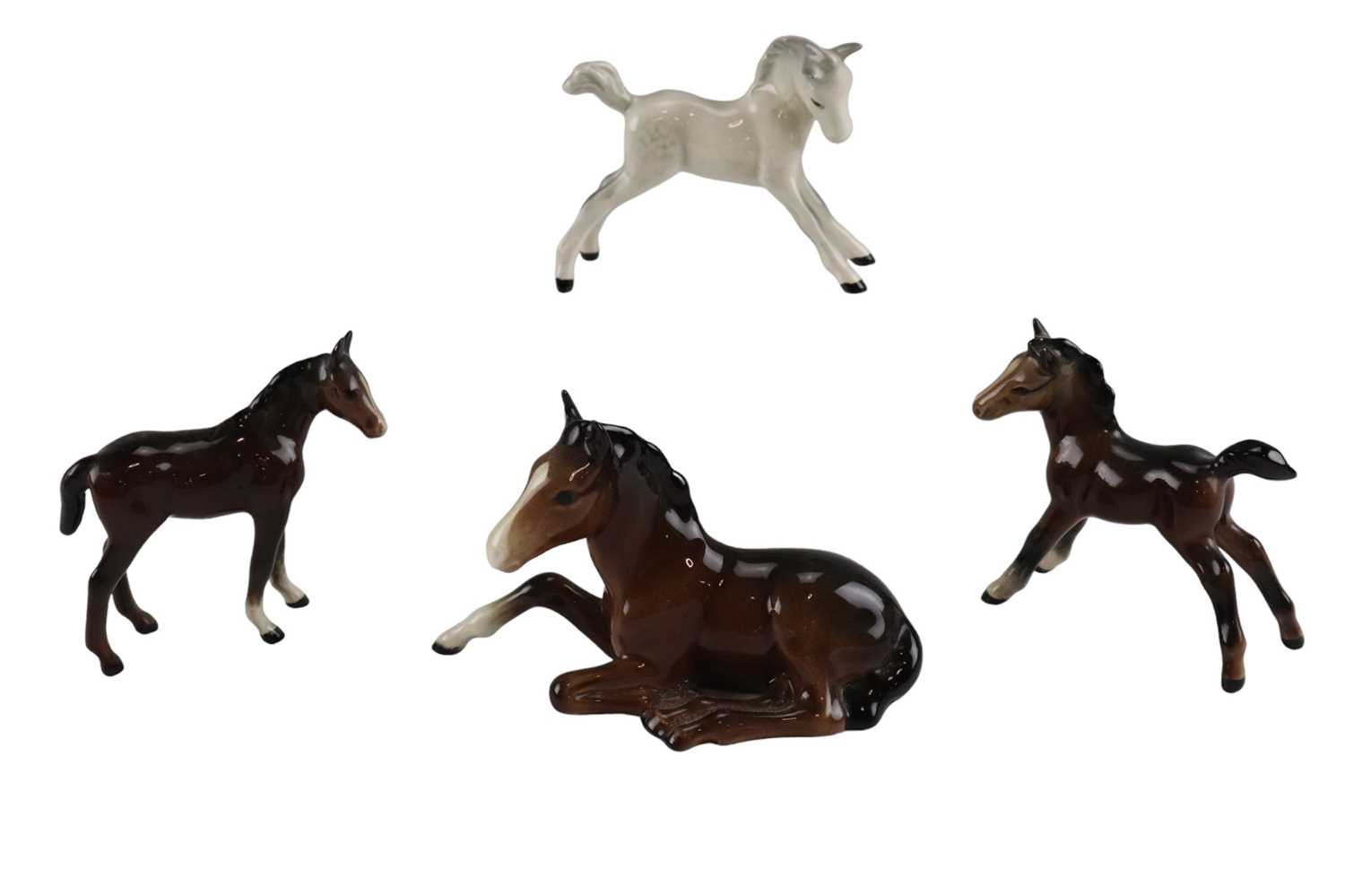 Four small Beswick horse figurines, tallest 9 cm