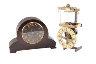 A novelty single pointer table clock, the escapement comprising a rotating arm swinging a ball and