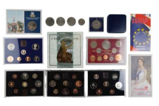A group of GB uncirculated coin packs together with a group of royal and other commemorative coins