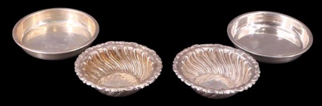 A pair of George V pin dishes together with a pair of Edward VII gadrooned salts or similar