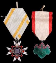 A Japanese Order of the Sacred Treasure, 6th Class, and an Order of The Rising Sun, 7th Class,