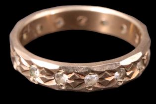 A 9 ct gold eternity ring, L, 2 g