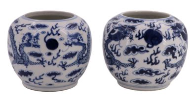 A pair of Chinese blue and white porcelain vases, of compressed ovoid form and decorated with