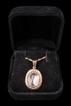 A moonstone pendant and chain, comprising an oval cabochon of approx 13 mm x 10 mm, set within a