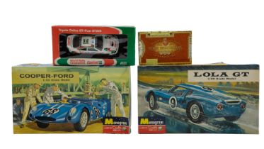 Two Monogram model car kits comprising a Lola GT and a Cooper-Ford together with a boxed Lledo