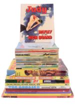 A group of 1970s children's books and annuals including Judy, Uncle Mac, The Six Million Dollar Man,