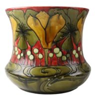 An early 20th Century Minton Secessionist cachepot, decorated with tube-lined flowers, marked '