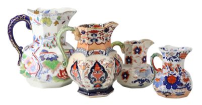 An uncommonly large Mason's Ironstone serpent-handled jug together with three other jugs, tallest