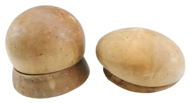 Three late 19th / early 20th Century wooden hat moulds, largest height 15 cm