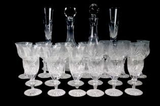 A set of six French cut glass wine glasses (one spare) together with two decanters, two sets of
